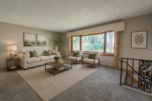 The living room has a beautiful Bay window that lets in lots of natural light throughout the day and has picture perfect views of the front yard. Original wrought iron railing and handles gives the home a mid century modern feel. Virtually staged.