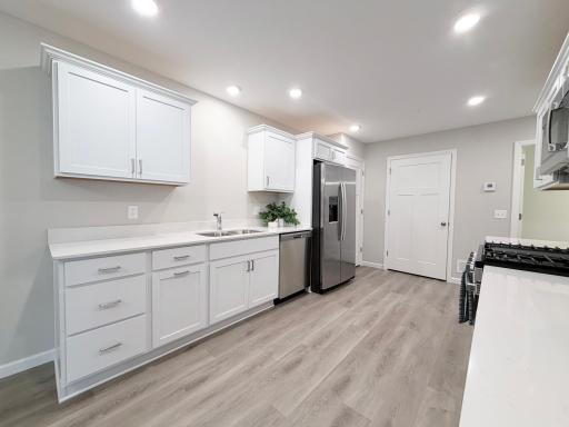 Quartz counter tops, stainless steel appliances and vinyl plank floor, sophisticated feel with easy maintenance.
