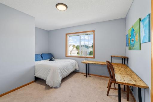 Upper level bedroom 4. Whether you need a comfortable bedroom, home office, or study space, this room offers flexibility to fit your lifestyle.