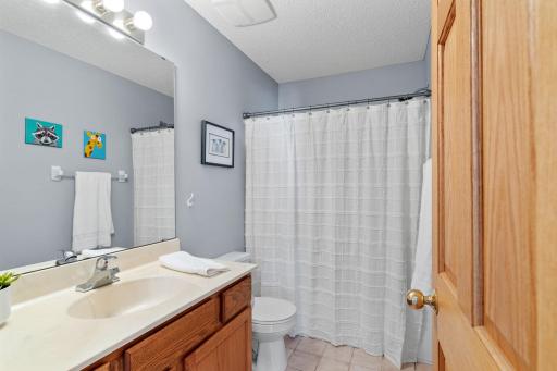 tart your mornings with ease in this convenient full bathroom featuring a spacious vanity and tub/shower combination.
