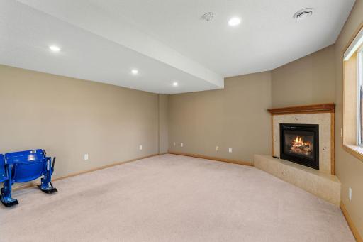 icture cozy movie nights by the fireplace or hosting friends for the big game in this spacious family room.