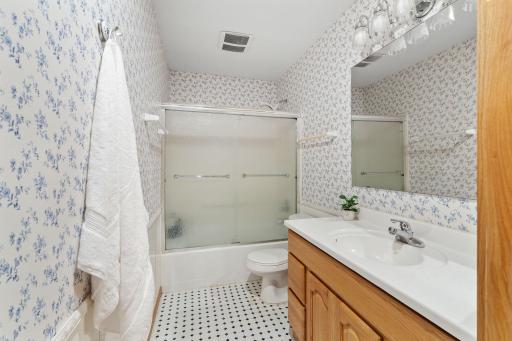 A convenient full bathroom makes the lower level ideal for overnight guests or extended stays.