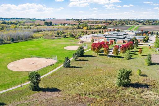 njoy the benefits of neighborhood living without another row of homes directly behind you. Instead, take in open fields, baseball diamonds, and countryside views.