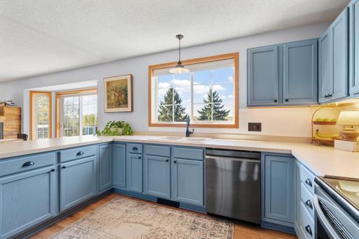 Enjoy beautiful backyard views while doing the dishes, with plenty of counter space for preparing your favorite meals