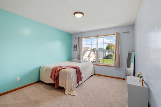 upper level bedroom 2. Bright, comfortable bedroom ready to become your own personal retreat.