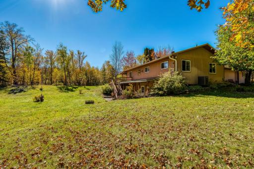 Side view with walkout basement and patio