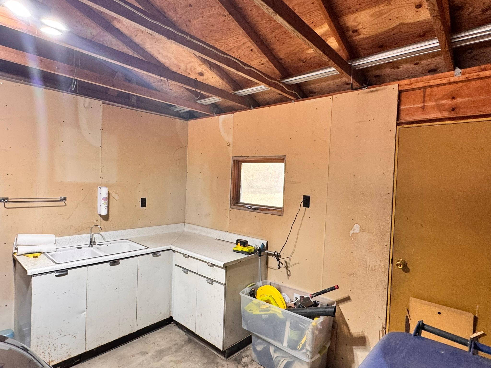 Produce cleaning/or fish cleaning area in the attached garage.jpeg