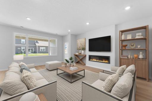 The 20x16 family room is an inviting space to relax and entertain. The fireplace provides a focal point with outlet above to mount your T.V. Similar home shown. Color and options can vary.