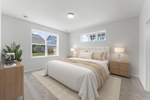 The owner's suite tucked on the back side of the home provides a true oasis with on-suite bath and large walk-in closet. Similar home shown. Color and options can vary.
