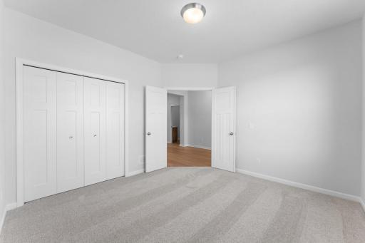 Located at the front of the home, double doors lead to the multi use secondary bedroom can be used as an office. Similar home shown. Color and options can vary.