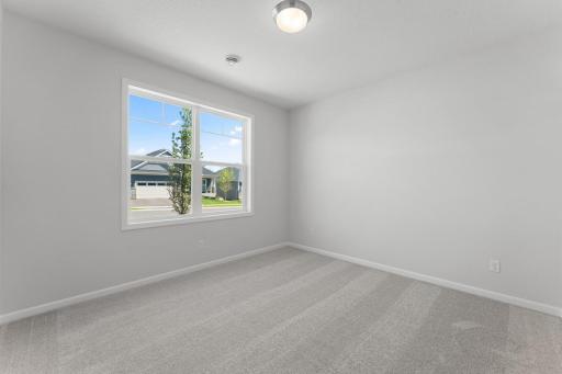 One of two secondary bedrooms. Similar home shown. Color and options can vary.
