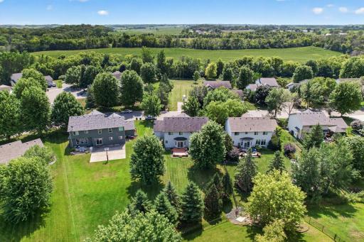 Aerial showing mature trees in front and back Green as far as the eye can see! 130