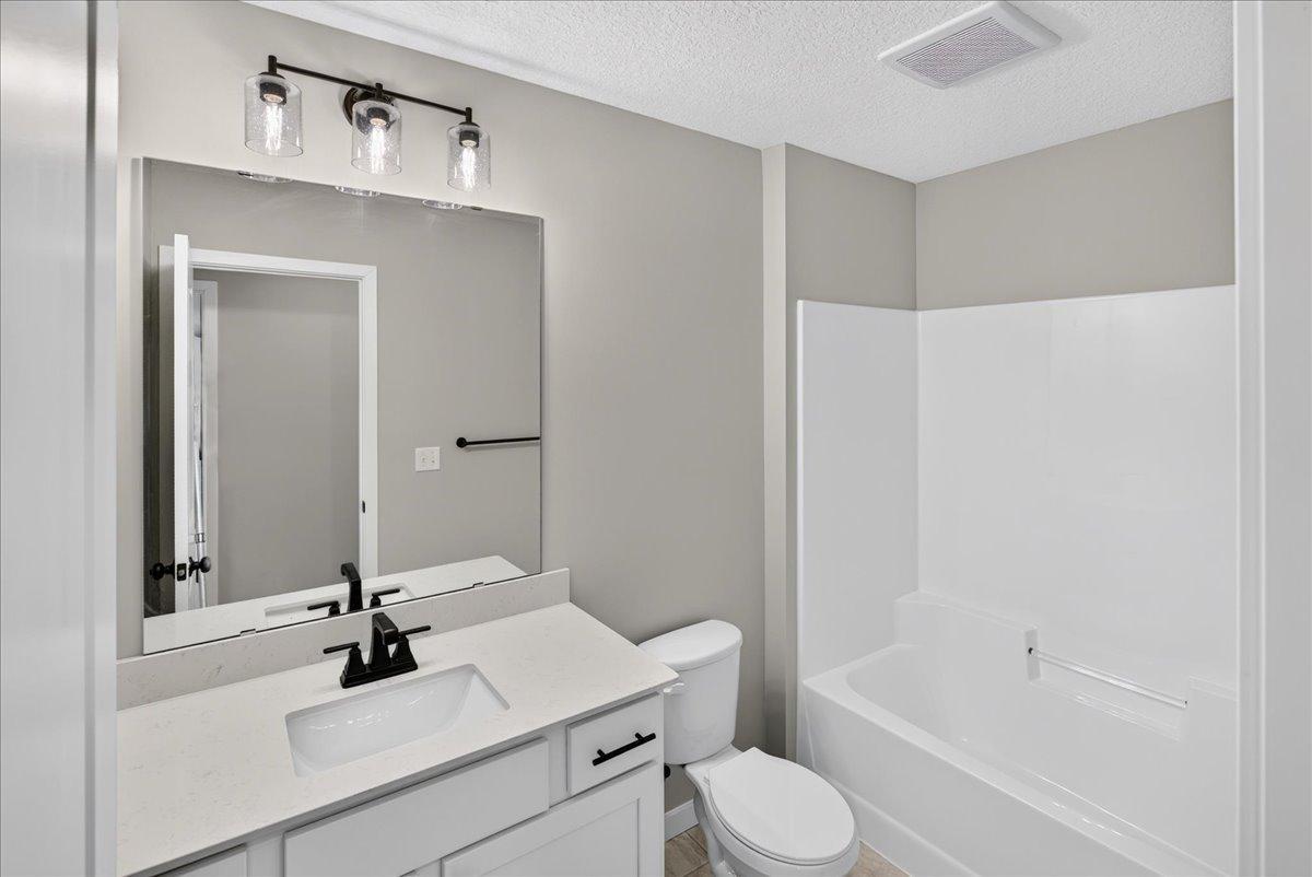 7077 Kittredge Lane NE- Upper Level Main Full Bathroom.