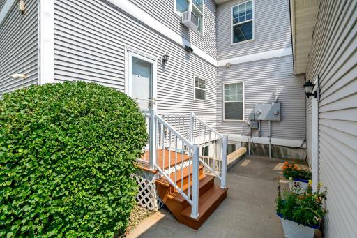 Private back patio and entrance to garage