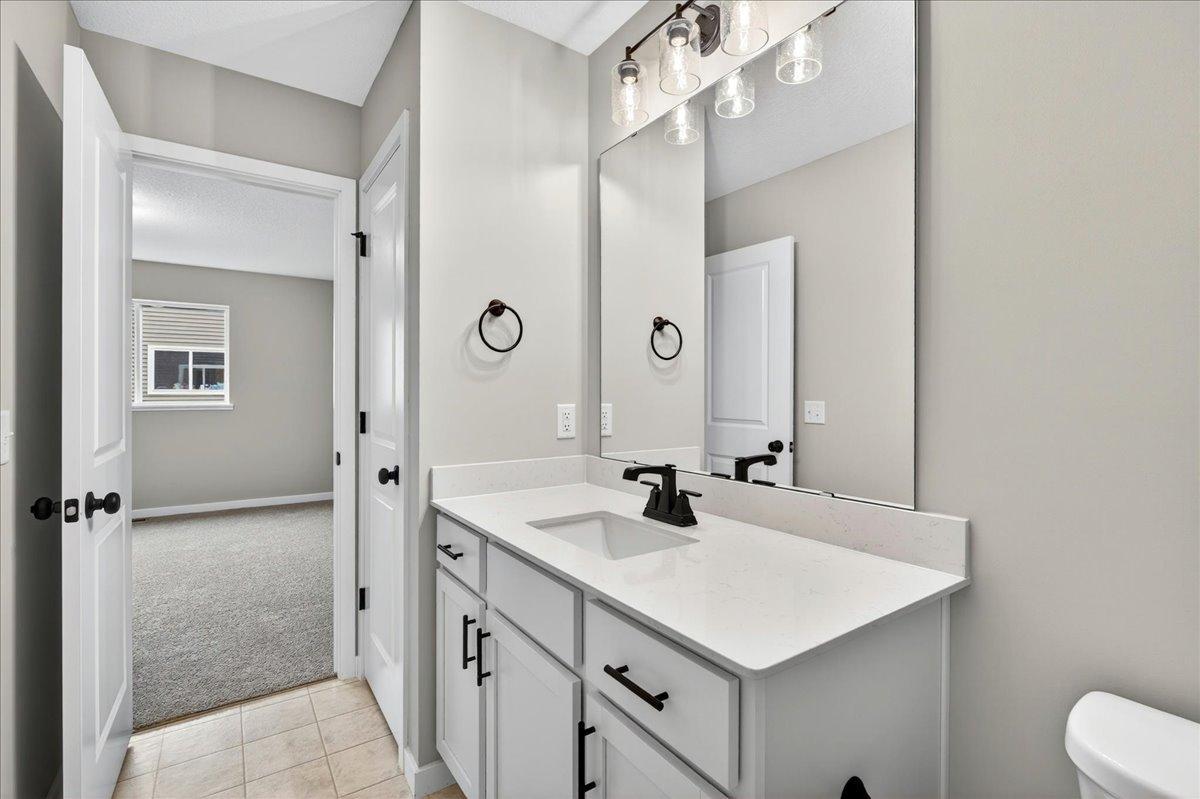 Primary Bathroom. Photo taken of another home with similar plan and finishes.
