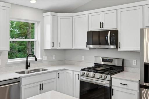 Photo taken of another home with similar plan and finishes.