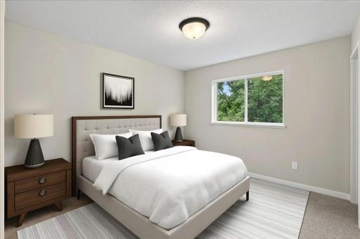 Bedroom 2. Photo taken of another home with similar plan and finishes. Virtually Staged.