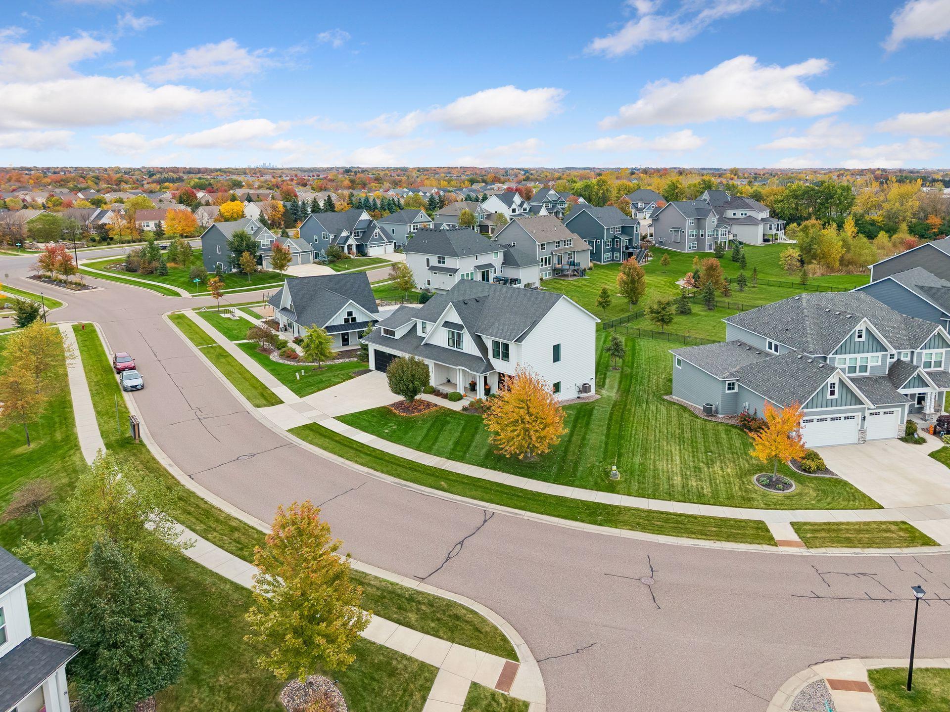 Nestled in The Woods at Rush Creek, a sought-after Maple Grove community with an exceptional neighborhood setting.