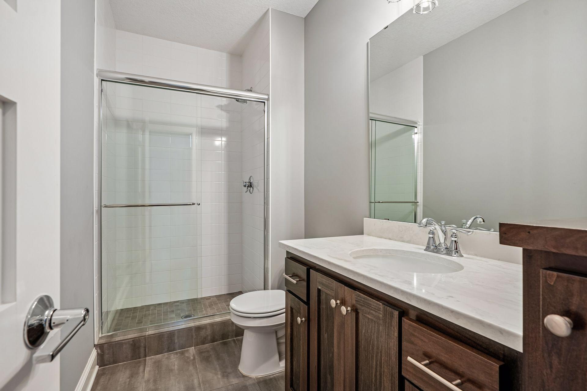 Lower level 3/4 bath with a tile shower!