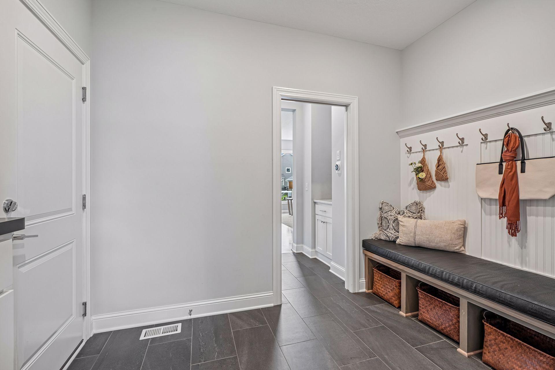 An expansive mudroom featuring custom-fit bench covers!