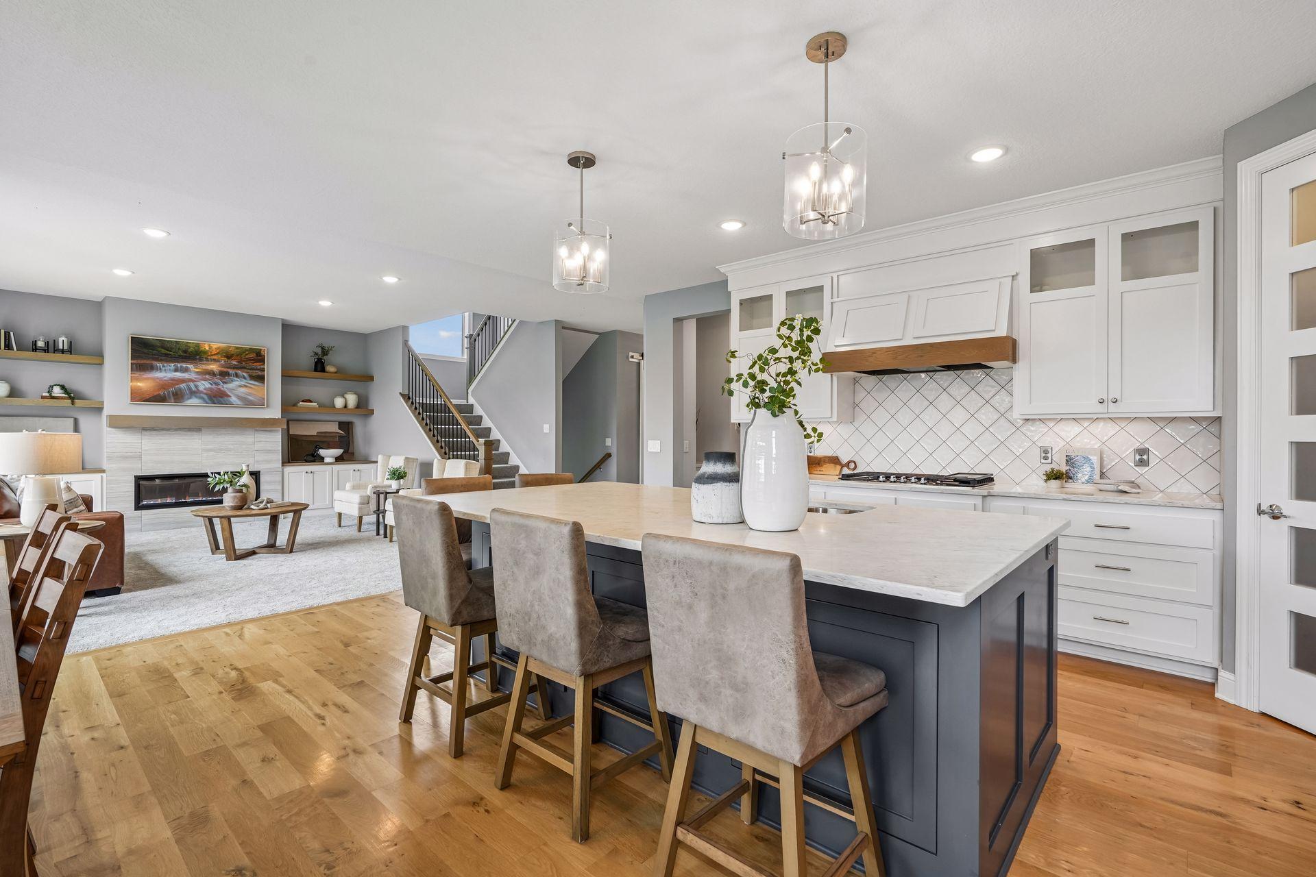 Cooktop with designer hood and double ovens make entertaining effortless.