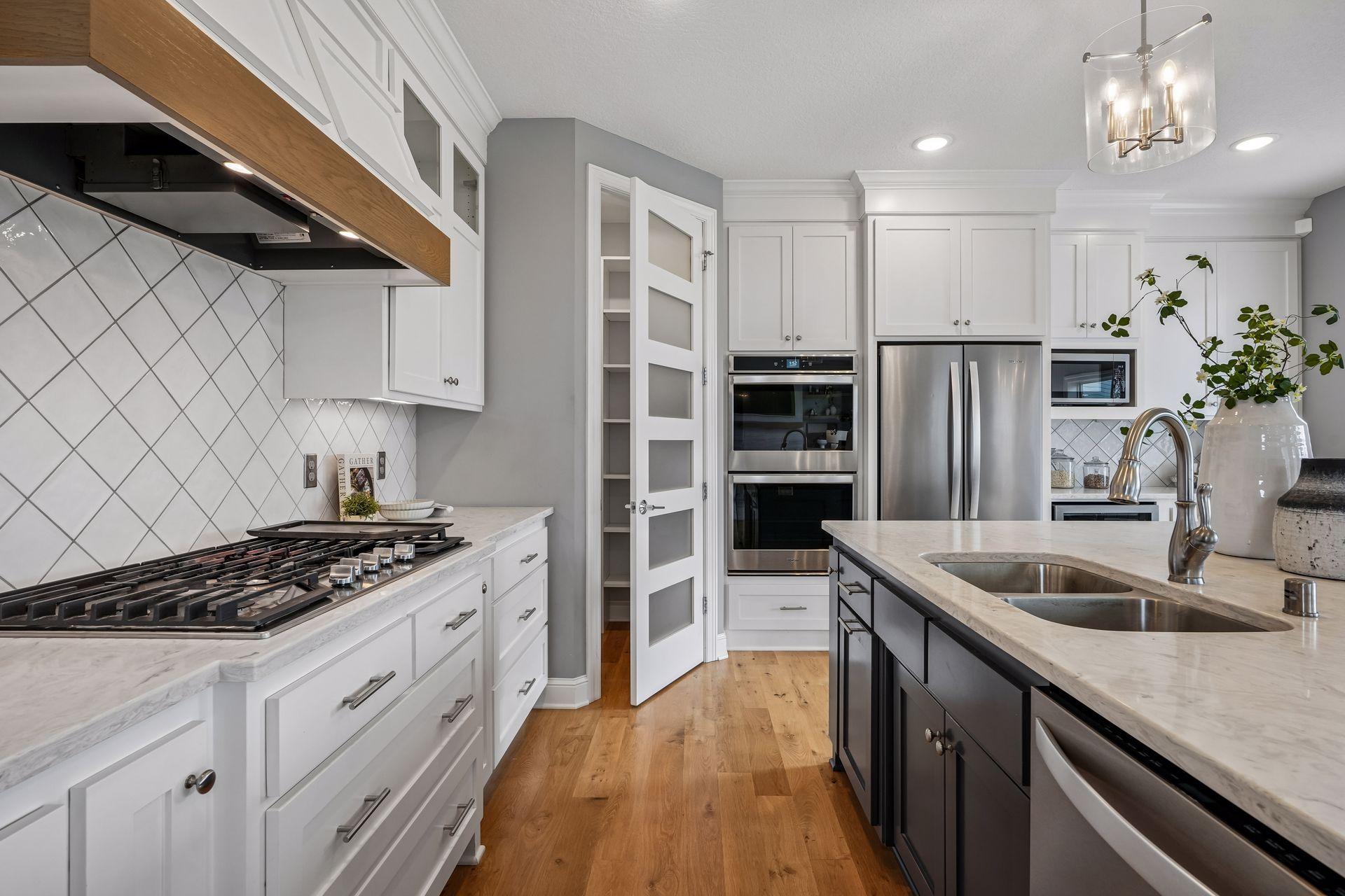 A spacious corner pantry provides convenient storage for all your kitchen essentials.