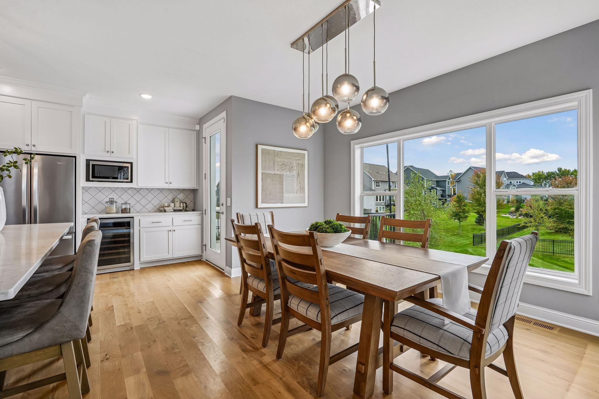 A generous informal dining area flows seamlessly to the maintenance-free deck, creating the perfect setting for relaxing or entertaining.
