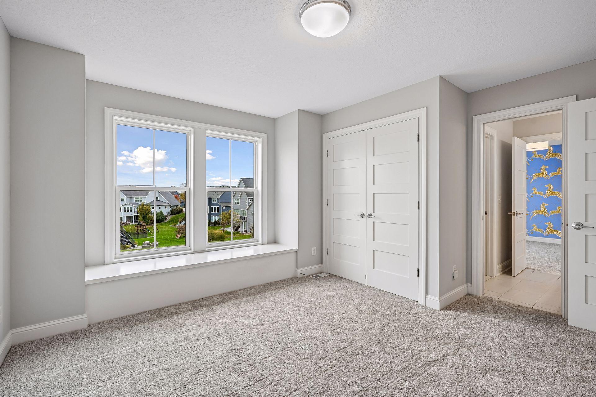Two upper-level bedrooms feature charming built-in window seats, creating cozy spots to relax and unwind.