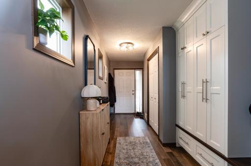 Elegance starts at the front door with the custom coat-shoe locker.jpg