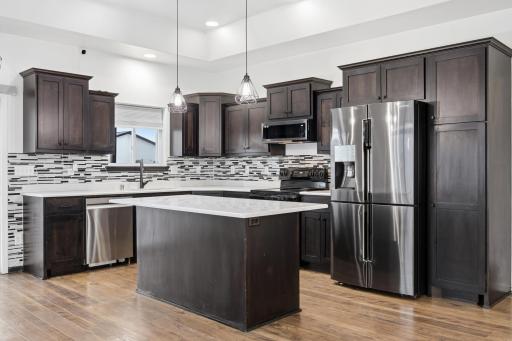 Kitchen (granite countertops, updated flooring, side pantry, updated fixtures, SS appliances)