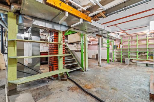 Basement offers space to work and great storage space with built-in shelving