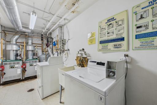 Conveniently located across the hall from the unit, this shared laundry and utility room features washers and dryers, a utility sink, and designated storage closets (#3) for residents.