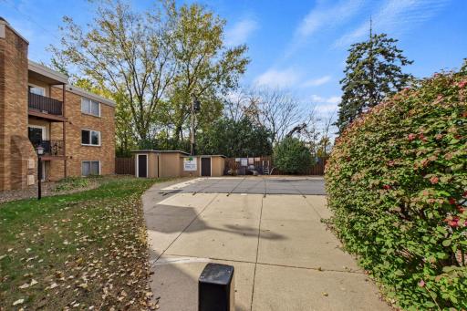 Outdoor Pool: Residents can enjoy the community's outdoor swimming pool and surrounding green space during the warmer months.