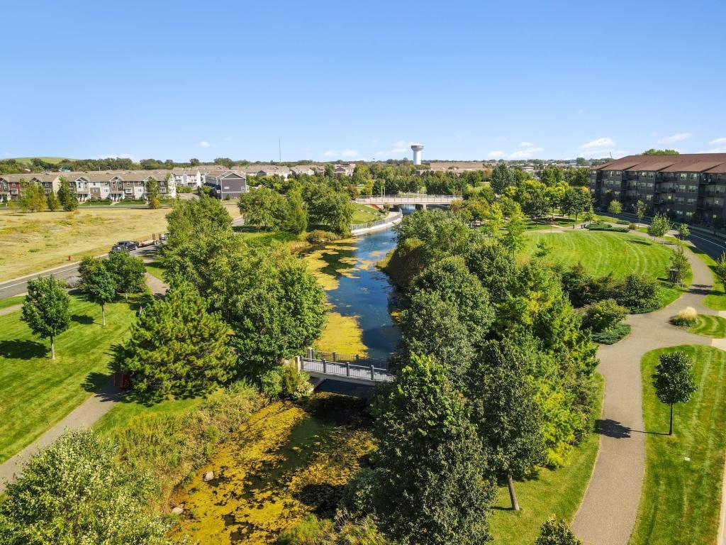 Enjoy lush tree lined views along the walking paths at The Draw Park.