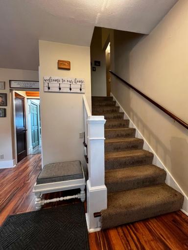 View of Hallway to the kitchen, Stairway to the upper level.