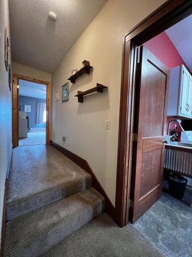 Hallway to Primary Bedroom and Laundry Room.