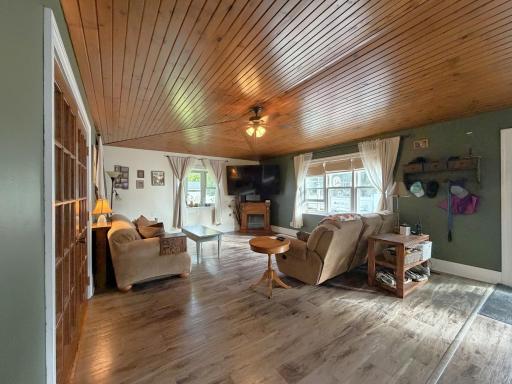 Family Room with Vaulted Ceiling and Door to back deck, patio and yard.
