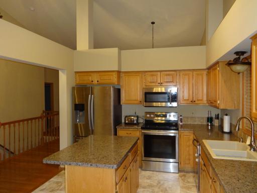 4 - Kitchen with center island and SS appliances.JPG