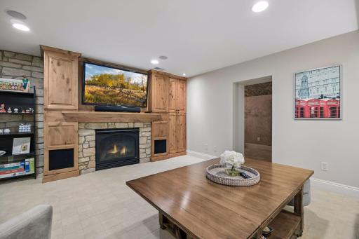The lower level family room includes the 3rd and final gas fireplace