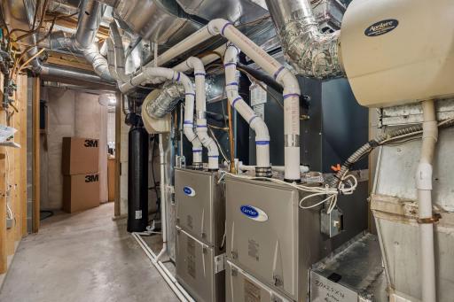 Mechanical room with access to more storage space and workshop