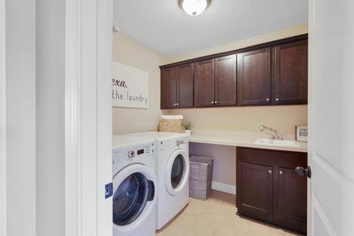 A thoughtfully designed space that keeps laundry close to the bedrooms while providing plenty of room for storage, folding, and everyday organization.