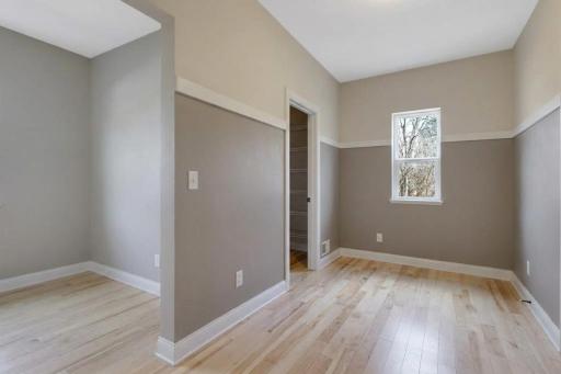 Convenient mudroom just off the garage featuring a storage closet and a versatile open area ideal for a home office, study nook, drop zone, or additional flex space.