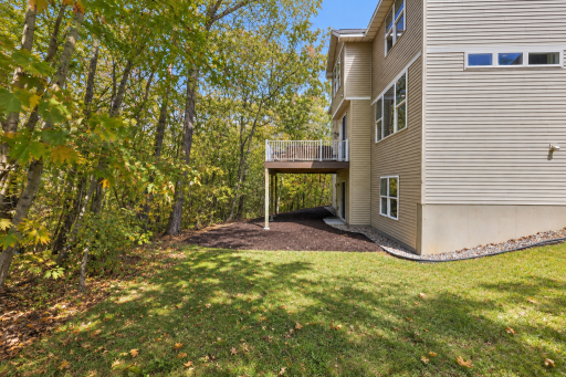 Enjoy a private backyard setting surrounded by mature trees and natural beauty. The elevated deck provides a great spot to relax or entertain, while the walkout lower level offers convenient access to the yard.