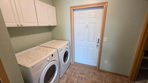 Separate laundry with pocket door, leads to garage.