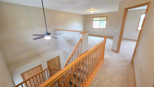 view of the open upstairs, including loft.