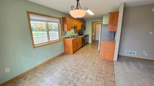 Dining area flows nicely from living room to kitchen