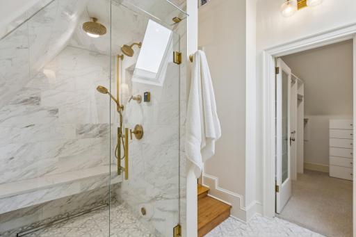 Spa-like steam shower and infloor heat in the remodeled owner's suite