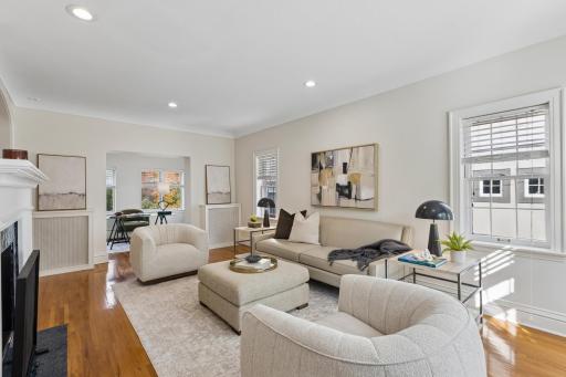 Living room with generous windows and room for multiple seating areas
