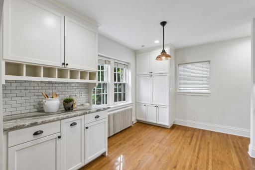 Built-in cubbies and pantry cabinet in the kitchen