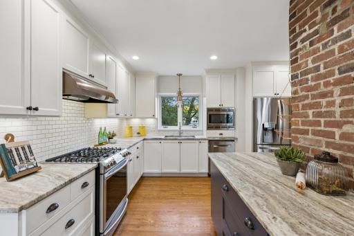 Exposed brick adds warmth and character to the kitchen